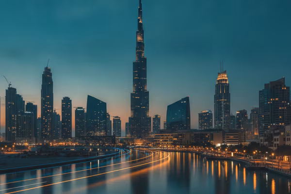 Dubai skyline glowing at blue hour