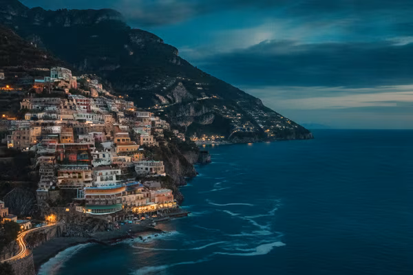 Amalfi coast cliffside village at dusk