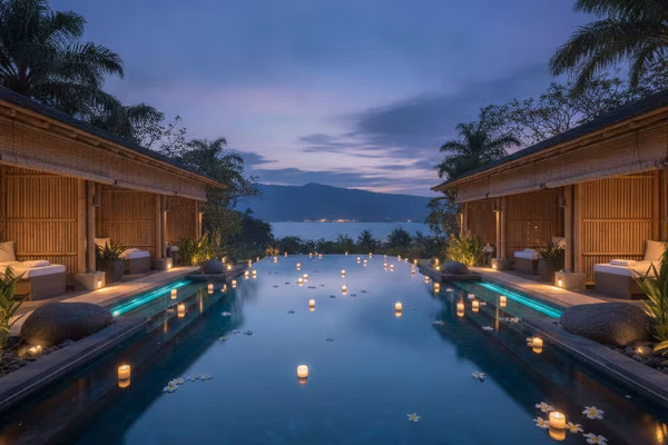 Spa infinity pool with floating candles at night