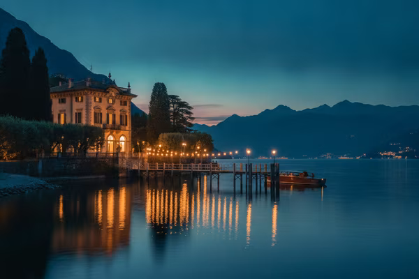 Lake Como lakeside villa with pier at dusk